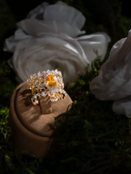 Honeycomb openwork ring with oval yellow sapphire and clear stone halo