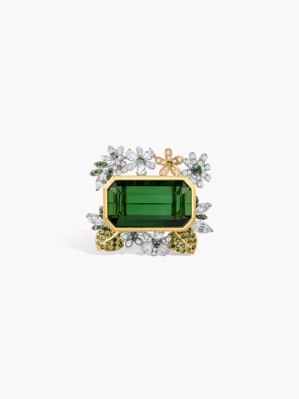 Gold ring featuring a green rectangular stone with glittering clear side clusters