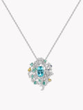 Gemstone pendant necklace with teal center stone and halo of white diamonds