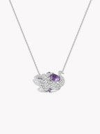 Silver swan pendant necklace with oval purple gemstone and pavé swan-wing details