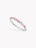 Layered crystal bracelet with pink gemstone accents and silver-tone links