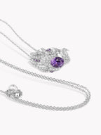 Silver-tone swan pendant necklace with round purple sapphire and pavé accents