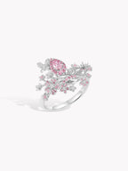 Pink diamond butterfly bloom ring with pear-shaped center stone, silver-toned band.