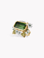 Gold ring with rectangular green tourmaline, diamond cluster and floral accents