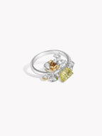Silver gemstone ring with green cushion stone, clear pave details and gold-tone accents