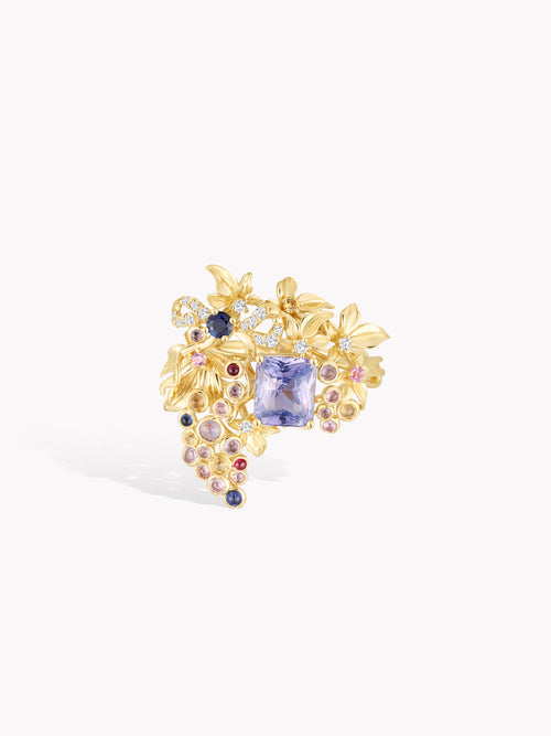 Gold grape-vine cluster ring with square purple sapphire centerpiece and round purple stones