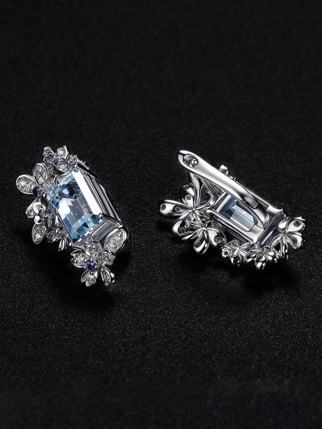 Silver floral halo earrings with light blue aquamarine-style center stones