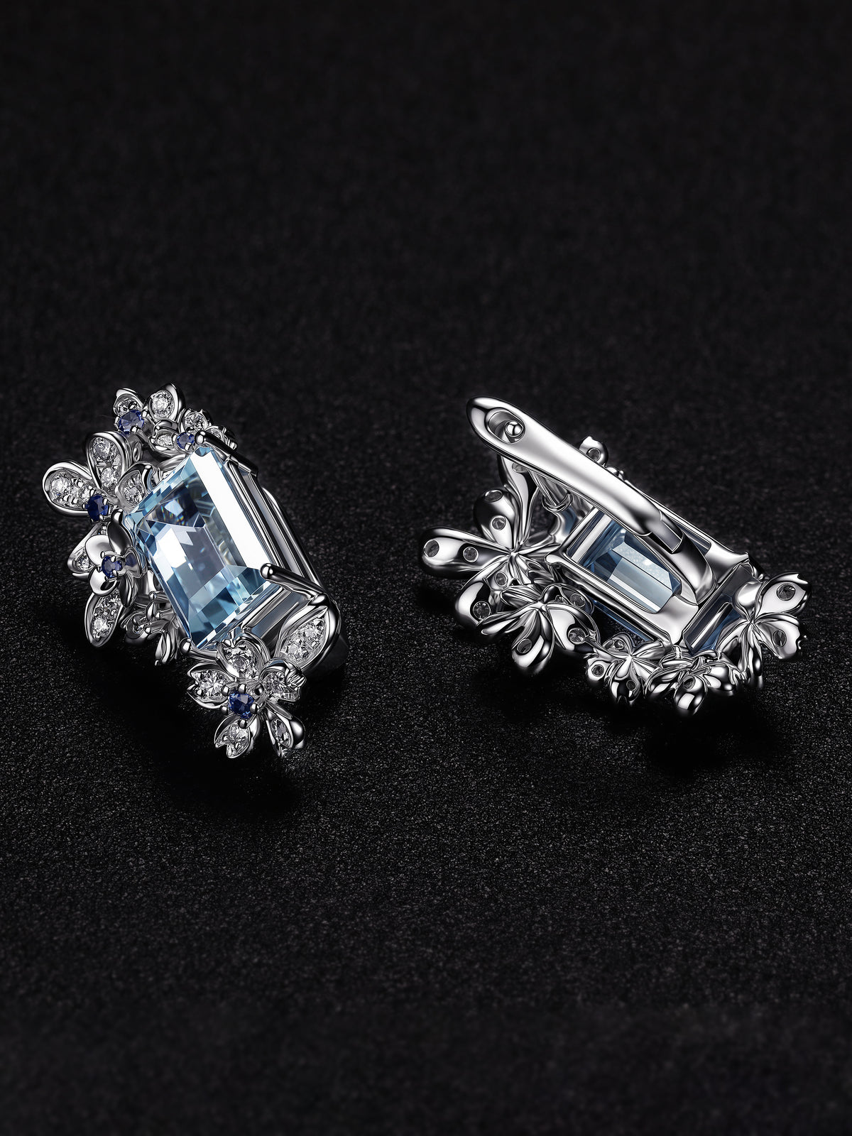 Silver floral halo earrings with light blue aquamarine-style center stones