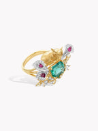 Gold deer motif ring with emerald-cut teal center stone and pink and clear accents