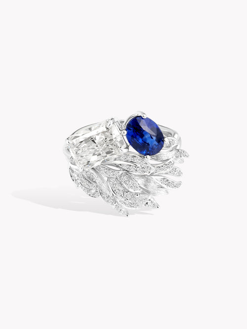 Swan wing diamond ring with large oval blue sapphire and sparkling details