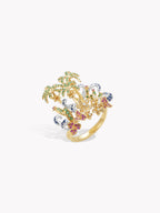 Gold-tone ring with green palm tree motif and blue and pink gemstone accents
