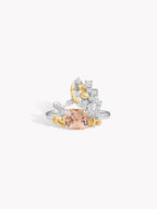 Test ring with silver band, peach oval center, gold and clear side stones