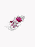 Silver ring with large pink-red oval center gemstone and clustered small berry stones