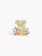 Gold-tone gemstone ring with palm trees and clustered blue and pink stones