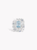 Aquamarine and diamond snowflake ring with blue oval center stone and icy halo