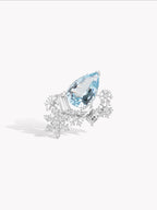 Silver-tone ring with blue pear gemstone and crystal snowflake accents