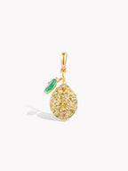 Lemon-shaped pendant with textured gold-tone surface and green gemstone detail