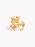 Maple leaf open ring with gold-tone branches and a central yellow oval stone