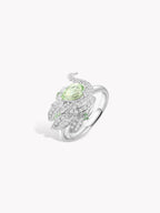 Silver ring with mint-green oval center stone and sparkling swan motif, openwork band