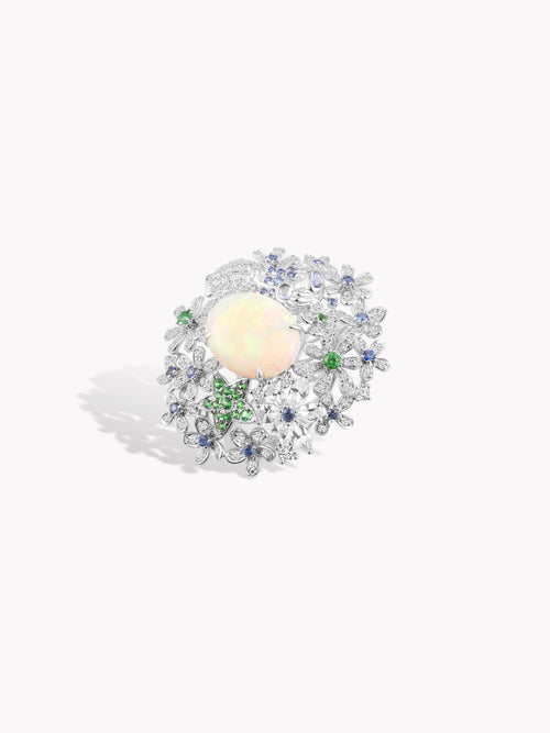 Opal starfish ring, oval opal center with blue stones and green highlights in silver