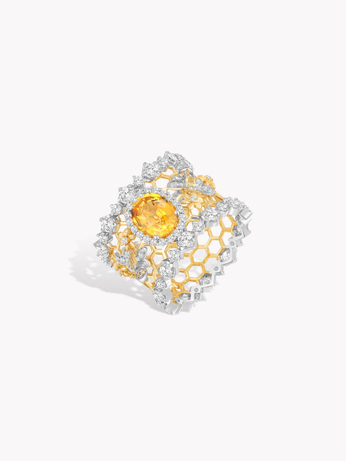 Honeycomb openwork ring angled view, yellow oval center gemstone with silver-toned lattice