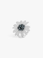 Sunflower gemstone ring with blue center crystals and textured silver petals