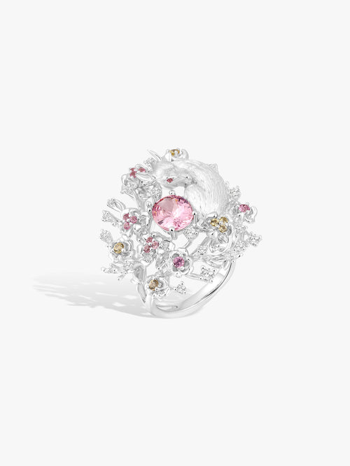 Floral branch ring with pink oval gemstone, pink and yellow accents, clear diamonds