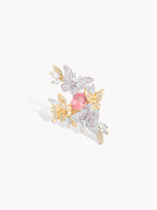 Butterfly motif ring with pink oval gemstone, mixed gold and silver pavé wings