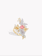 Butterfly motif ring with pink gemstone centerpiece, gold band and clear stone wings