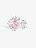 Strawberry ring: oval pink spinel, pavé white stones, small yellow accents