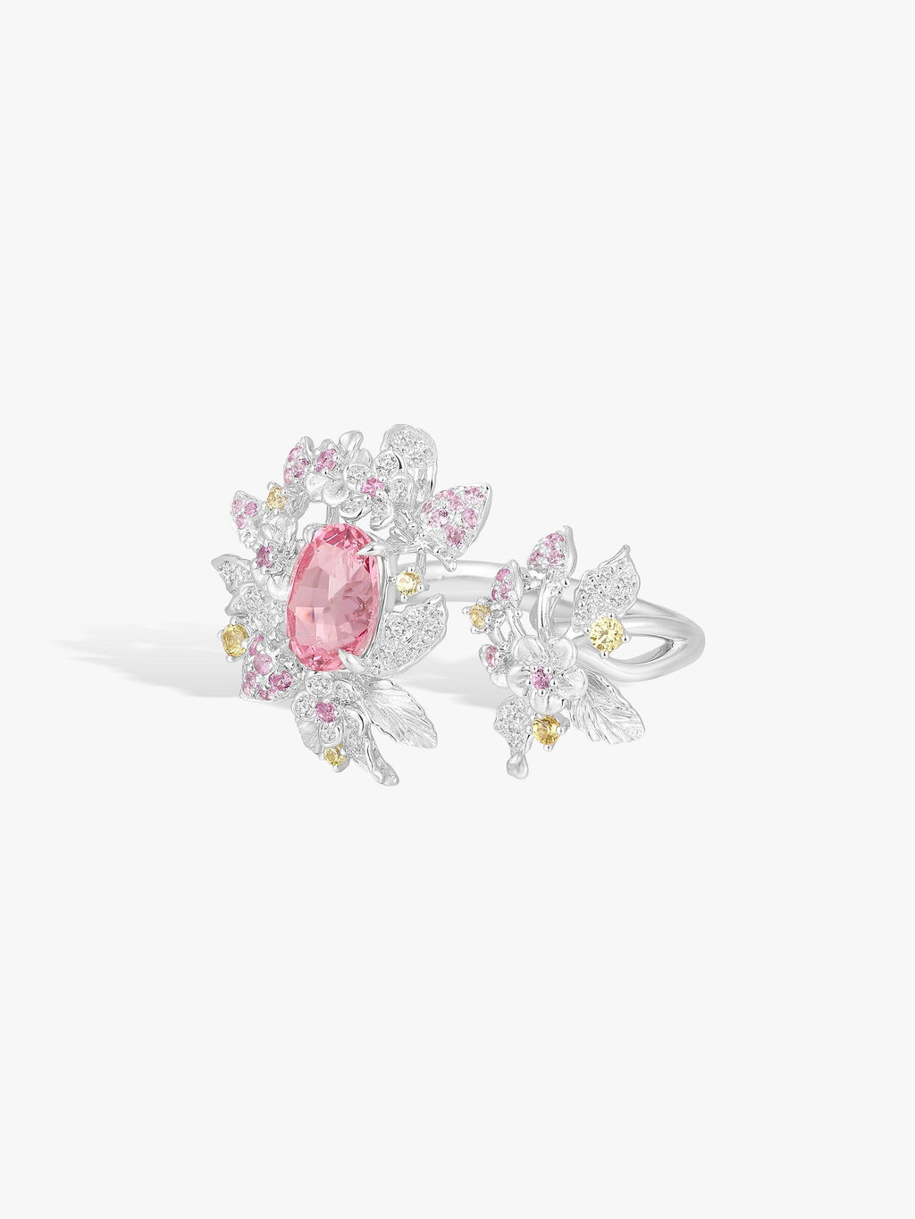 Strawberry ring side view: pink oval spinel with white and yellow-toned pavé stones
