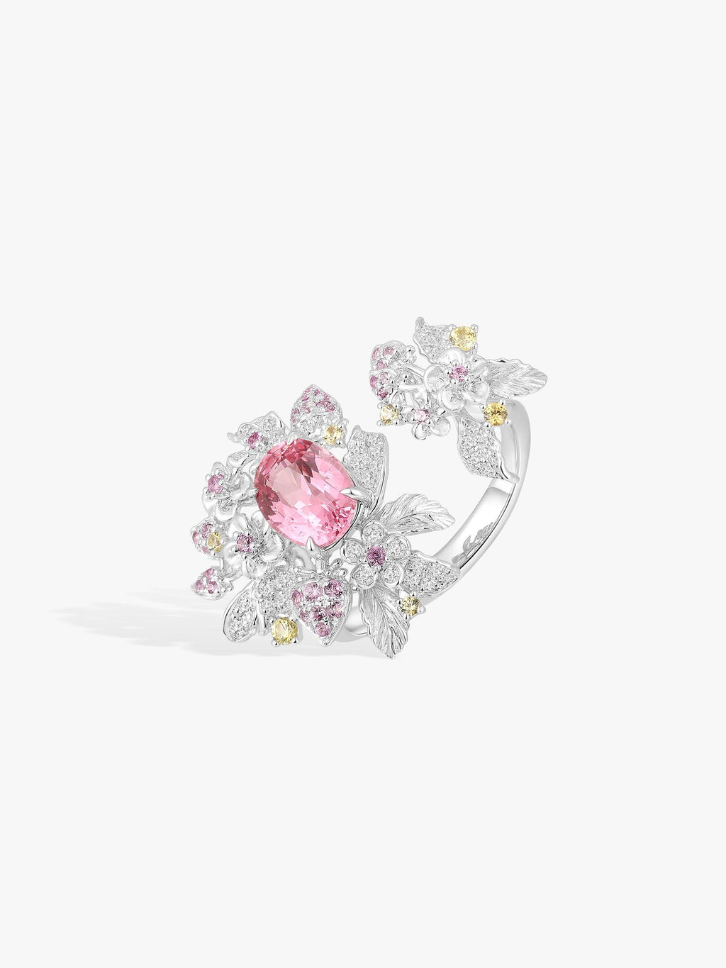 Strawberry ring with pink oval center, white pavé leaves, gold-tone accent stones