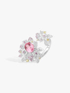 Strawberry ring with pink oval gemstone, diamond pavé floral design and yellow accents, white metal