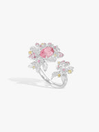 Strawberry ring with pink oval gemstone, diamond pavé floral clusters on white metal band