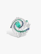 Emerald and sapphire geometric oval ring in silver tone, with bezel-set center stone