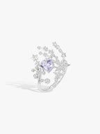 Silver meteor-style ring with cushion-cut gray-blue center stone and star diamond accents