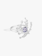 Silver meteor-style ring with cushion-cut gray-blue center stone, star and round diamond details