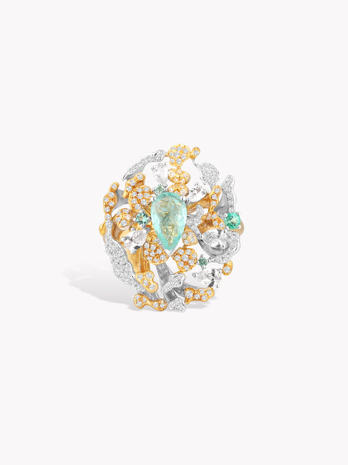 Coral wave ring with oval turquoise centerpiece and gold-and-silver pavé stones