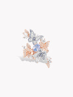 Floral lacewing sapphire ring with blue center stone, rose gold band, multi-color pavé
