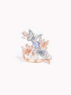 Rose gold lacewing sapphire ring, blue center stone, crystal pavé and openwork details