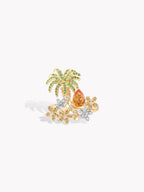 Gold-tone ring with raised palm tree and orange stone cluster, clear flower details