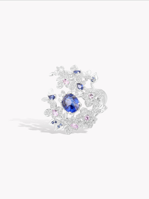 Rose garden ring, blue sapphire surrounded by diamond floral prongs