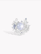 Starlit Siren Harp ring, silver-toned filigree with oval white stone and blue gems