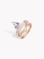 Rose gold double-band ring with triangular purple stone and side diamond pave