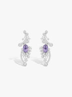 Crescent moon and star earrings with purple gemstone centers, silver-tone pavé, stud style