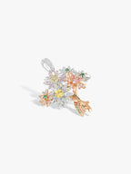 Angled multi-color diamond daisy bouquet pendant with gold-toned branches and blooms