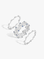 Swan-wing ring with blue sapphire-like stones and white diamond accents in openwork design