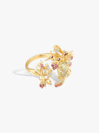 Gold open lily-of-valley branch ring, light green center stone, pink accents