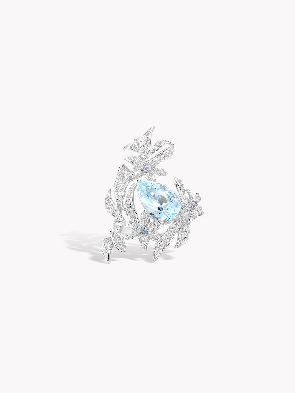 Silver lily flower ring with oval aquamarine-blue center stone and crystal details