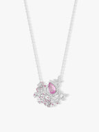 Layered sapphire and diamond necklace with pink oval center and scattered flower motifs
